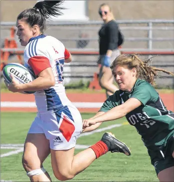  ?? SUBMITTED ?? Acadia fullback Alysha Corrigan outruns an attempted tackle by UPEI’s Maddy Shea (15) in Atlantic University Sport women’s rugby action earlier this season in Wolfville, N.S.