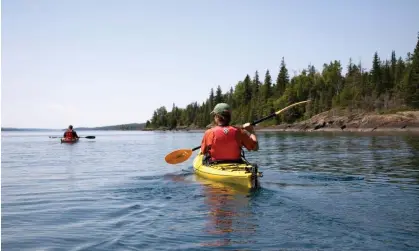  ?? Photograph: Per Breiehagen/Getty Images ?? A person kayaks in the middle of Lake Superior in Michigan.