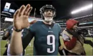  ?? MICHAEL PEREZ — THE ASSOCIATED PRESS ?? Philadelph­ia Eagles’ Nick Foles celebrates after an NFL divisional playoff football game against the Atlanta Falcons, Saturday.