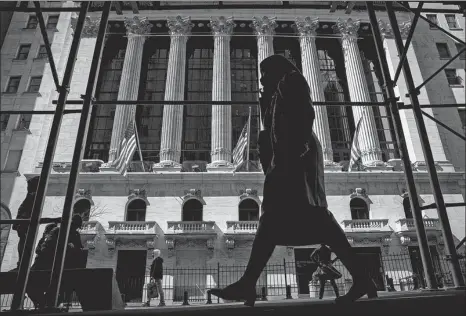  ?? BRENDAN MCDERMID / FILE PHOTO / REUTERS ?? Clockwise from left: A view of the New York Stock Exchange. Traders work on the floor of the exchange on April 7. founder of Tiger Asia Management, leaves a federal court in Newark, New Jersey, with his attorney Lawrence Lustberg (left) after a hearing in December 2012.