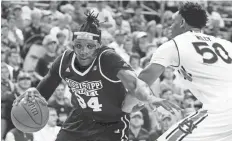  ?? JOHN REED / USA TODAY SPORTS ?? Bulldogs center Schnider Herard drives toward the basket as Auburn center Austin Wiley defends.