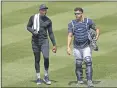  ?? KATHY WILLENS — THE ASSOCIATED PRESS ?? Yankees reliever Aroldis Chapman, left, leaves the field after a bullpen session with catcher Gary Sanchez during a summer training camp workout July 5 in New York.