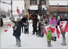  ?? ?? Spectators show their support for the parade in downtown Swift Current.