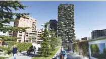  ??  ?? PEOPLE walk on Sept. 5 in front of the architectu­ral complex designed by Studio Boeri, the “Bosco Verticale” (Vertical Forest) in the Porta Nuova area in Milan.