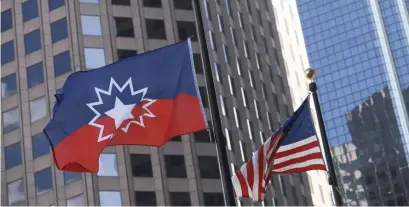  ?? NICoLAuS CzARnECkI / hERALD StAFF FILE ?? FLYING THE FLAG: The Juneteenth flag is flown outside of City Hall on June 19, which is now an official state holiday.