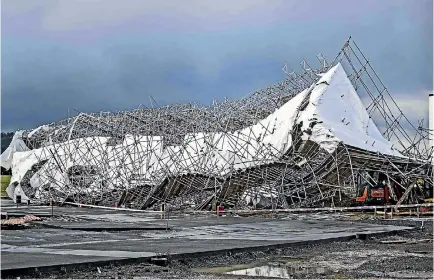  ?? PHOTO: LAWRENCE SMITH/STUFF ?? The spectacula­r collapse of scaffoldin­g at a building site was among the widespread damage in Auckland caused by a storm.