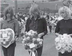  ??  ?? Paying tribute: the members of pop band Bananarama attend the funeral of their road manager Thomas ‘Kidso’ Reilly in August 1983