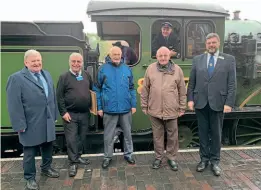  ?? PETER MAYNE ALLEN/NNR ?? Pictured at Sheringham with B12 No. 8572, the locomotive which the brothers saw at Stratford almost 60 years before, are (left to right) North Norfolk Railway managing director Hugh Harkett, M&GN Society chairman Neil Sharpe, Roger and Andy Ison, general manager Andrew Munden and (in the cab) chief mechanical engineer Keith Ashford.