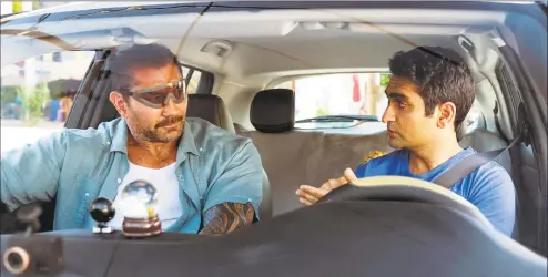  ?? Mark Hill / 20th Century Fox / Associated Press ?? Dave Bautista, left, and Kumail Nanjiani in a scene from “Stuber.”