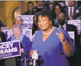  ?? Bob Andres / TNS ?? Stacey Abrams speaks to supporters in March, when she qualified to run for governor.