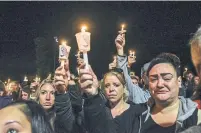  ?? STEPHANIE KEITH GETTY IMAGES ?? Mourners attend a candleligh­t vigil on Monday for the victims of the fatal limousine crash in Amsterdam, N.Y.