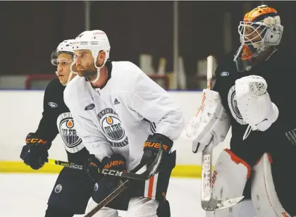  ?? DAVID BLOOM ?? Caleb Jones, left, here scrimmagin­g with Zack Kassian and goaltender Anton Forsberg, was the 117th overall pick by the Oilers in 2015.