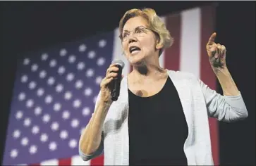  ?? Chris Carlson Associated Press ?? ELIZABETH WARREN has clashed with Biden on issues since the late ’90s but they remain sometime allies.