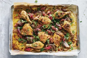  ?? MALOSH/THE NEW YORK TIMES FOOD STYLED BY SIMON ANDREWS. PHOTOS BY DAVID ?? Sheet-pan chicken with rhubarb and red onion in New York on May 12. This easy, jewel-tone roast chicken is tangy-sweet, weeknight-fast and full of savory schmaltz.