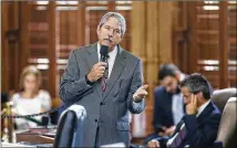  ?? RICARDO B. BRAZZIELL/AMERICAN-STATESMAN ?? Senate Education Chair Larry Taylor discusses the education bill on the Senate floor. He rejected the $1.8 billion House proposal as a fix for financing public schools.