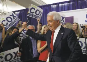  ?? Gregory Bull / Associated Press ?? Republican candidate John Cox greets a supporter during an election party in San Diego. His campaign could draw support from conservati­ves nationally.