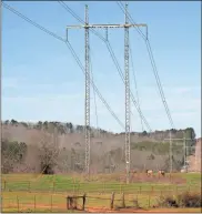  ?? Doug Walker ?? Georgia Power is looking to develop a large substation near this high voltage power line at Spout Springs Road and U.S. 411 in Cave Spring. The utility has not locked down a specific site yet.