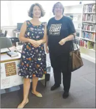  ?? Westside Eagle Observer/SUSAN HOLLAND ?? Melinda Griffin (left), the librarian at the Sulphur Springs Library, poses with Karen Benson, her counterpar­t at the Gravette Public Library. Griffin spent several months working at the Gravette library, learning from Benson and her staff in preparatio­n for her role as the librarian at Sulphur. She thanked them for sharing their “knowledge, creativity and enthusiasm for all things library.”