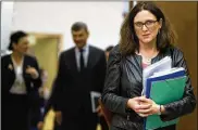  ?? VIRGINIA MAYO / AP ?? Cecilia Malmstroem, European commission­er for trade (right), arrives Wednesday at European Union headquarte­rs in Brussels. The EU is preparing to retaliate against proposed U.S. tariffs, she said.