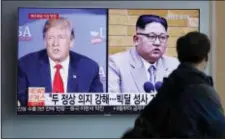  ?? LEE JIN-MAN - THE ASSOCIATED PRESS ?? In this May 11, 2018, file photo, a man watches a TV screen showing file footage of U.S. President Donald Trump, left, and North Korean leader Kim Jong Un with onscreen letters reading “Summit between U.S. and North Korea, Forecast, Clear.” during a...