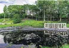  ?? MATTHEW PLACEK/THE GLASS HOUSE/THE ASSOCIATED PRESS ?? The mirrored spheres of Yayoi Kusama’s Narcissus Garden can be seen glinting in the sun from much of The Glass House estate’s 49 acres.