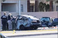  ?? Eric Jamison / Associated Press ?? Las Vegas Metro Police investigat­ors work at the scene of a fatal crash Tuesday in Las Vegas. Police say Raiders wide receiver Henry Ruggs III was involved in the fiery vehicle crash that left a woman dead and Ruggs and his female passenger injured.