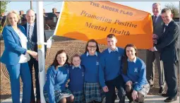  ??  ?? Miriam O’Callaghan with Donal O’Sullivan, Principal Colaiste Pobal Naoimh Mhuire with Ted Owens, CEO Cork ETB, Sean O’Sullivan, Chairperso­n of the Board of Management and students at the presentati­on of the Amber Flag for Positive Mental Health...