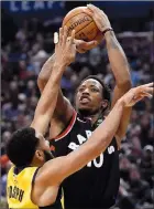  ?? CP PHOTO NATHAN DENETTE ?? Toronto Raptors guard DeMar DeRozan attempts to shoot over Indiana Pacers guard Cory Joseph during first half NBA basketball action in Toronto on Friday.