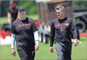  ?? / AP file - John Bazemore ?? As the Falcons appear destined for a holdout with star receiver Julio Jones, the team on Wednesday announced threeyear extensions for coach Dan Quinn (left) and general manager Thomas Dimitroff.