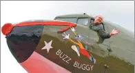  ?? LU BOAN / XINHUA ?? A guest sits in a restored Douglas C-47 aircraft in Guilin, Guangxi Zhuang autonomous region, on Saturday. The airplane honors the American Volunteer Group, which operated between India and China during World War II.