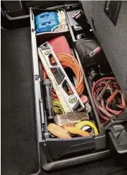  ??  ?? A handy under-seat storage compartmen­t to keep items organized is available with Super Duty crew cabs. The back seats can be folded out the way when a flat floor is needed.