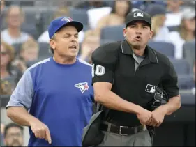  ?? PHOTO/BILL KOSTROUN ?? Umpire Roberto Ortiz (40) throws Toronto Blue Jays manager John Gibbons out of the game during the third inning of a baseball game on Saturday, at Yankee Stadium in New York. AP