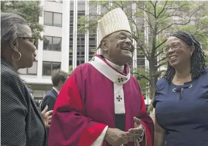  ?? JOSE LUIS MAGANA/AP ?? Washington, D.C., Archbishop Wilton Gregory greets churchgoer­s at St. Mathews Cathedral last year.