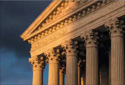  ?? J. SCOTT APPLEWHITE — THE ASSOCIATED PRESS FILE ?? The Supreme Court in Washington is seen at sunset. States will be able to force shoppers to pay sales tax when they make online purchases under a Supreme Court decision.