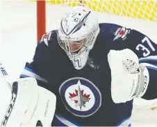  ?? KEVIN KING/POSTMEDIA NETWORK ?? Goaltender Connor Hellebuyck says that it’s his job to steal some games for the Winnipeg Jets.