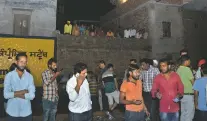  ?? PRABHJOT GILL/ASSOCIATED PRESS ?? A crowd gathers Friday at the site of a train accident in Amritsar, India, where a speeding train ran over a crowd watching fireworks during a religious festival, killing at least 58 people, a Congress party leader said.