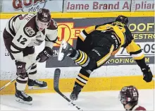  ?? CLIFFORD SKARSTEDT EXAMINER ?? Peterborou­gh Petes forward Chris Paquette upends Hamilton Bulldogs’ Matthew Strome in OHL action on Sept. 29 at the Memorial Centre.