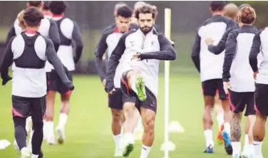  ?? Reuters ?? Liverpool’s Mohamed Salah along with his team-mates takes part in a training session on Monday.