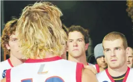  ??  ?? Right - Coach Hayden Burgiel speaks to his Gippsland troops during quarter time. His side would fall by nine points..