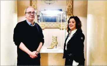  ?? AFP AFP ?? Exhibition curators Fabrizio Paolucci (left) and Lorenza Camin pose during the exhibition ‘Worn by the Gods’.