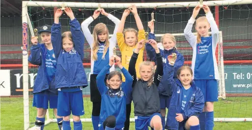 ??  ?? Macclesfie­ld Town Ladies Under 11s celebrate their success in the Altrincham Girls Tournament