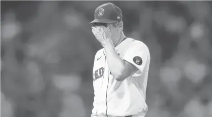  ?? MICHAEL DWYER/AP ?? The Red Sox’s Rich Hill leaves the field after being relieved during the fifth inning against the Orioles on Monday in Boston.