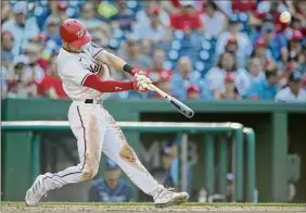  ?? Greg Fiume / Getty Images ?? Trea Turner of the Nationals hits a home run in the fourth inning against the Tampa Bay Rays at Nationals Park Wednesday in Washington.