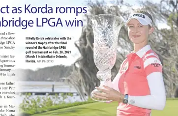  ?? AP PHOTO ?? Korda celebrates with the winner’s trophy after the final round of the Gainbridge LPGA golf tournament on Feb. 28, 2021 (March 1 in Manila) in Orlando, Florida.