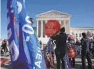  ?? Anna Moneymaker / New York Times ?? Supporters of President Trump rallied outside the Supreme Court Tuesday before it threw out a case seeking to invalidate millions of votes in Pennsylvan­ia.