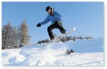  ??  ?? > Snowboarde­r Oli Nayler jumps at Storey Arms