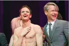  ?? MIKE PONT/GETTY IMAGES ?? Neil Patrick Harris, left, and John Cameron Mitchell during the curtain call at the Broadway opening night of Hedwig and the Angry Inch on April 22.