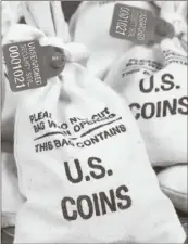  ??  ?? ■ UNSEARCHED: Pictured above are the unsearched Vault Bags loaded with nearly 3 pounds of U. S. Gov’t issued coins some dating back to the 1800’s being handed over to Pennsylvan­ia residents by Federated Mint.