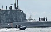  ??  ?? HMS Ambush showing the damage to her tower, above. Cdr Justin Codd, right, had been instructin­g at the time of the accident