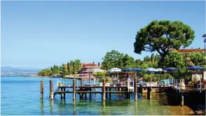  ??  ?? ABOVE Sirmione is tranquil and serene in the early morning, but it does get busy during the dayLEFT The ancient fortress at Sirmione originates from a Roman settlement here BELOW Portese is a small, picturesqu­e port, just a few minutes away from Camping Fornella, with some excellent eating places and great scenery for an early morning or evening stroll